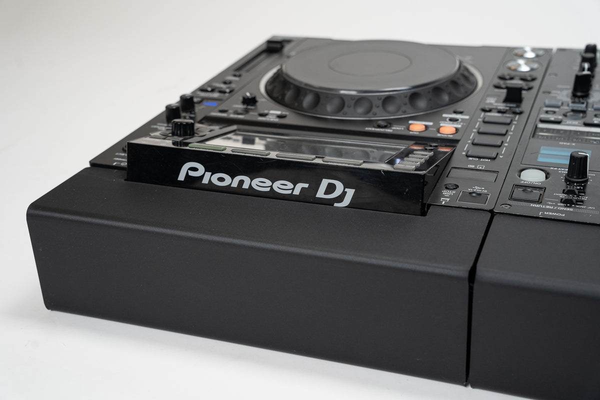 Close-up of a Pioneer CDJ-2000NXS2 on a Zero Cable cable cover next to the DJ mixer